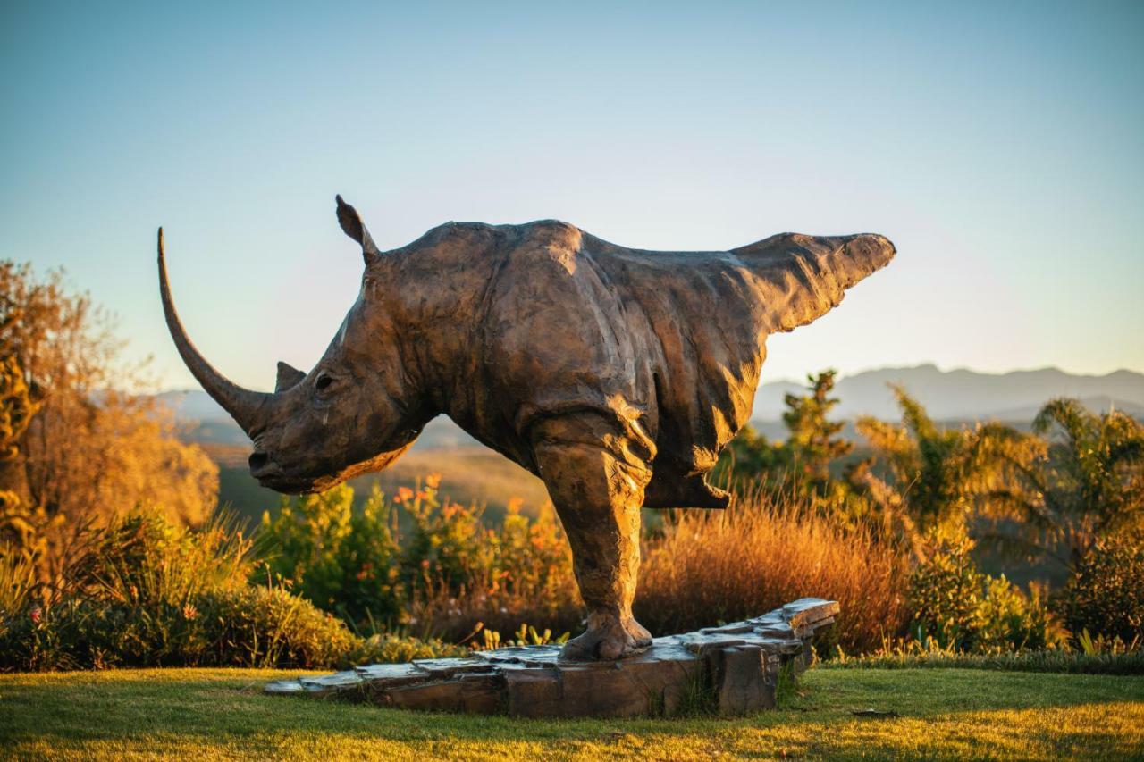Sky Villa Boutique Hotel By Raw Africa Collection Plettenberg Bay Kültér fotó The sculpture of a white rhinoceros at the entrance of the park